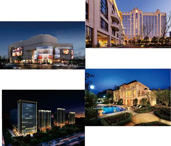 Luxury residential mansion with a swimming pool and landscaped gardens illuminated at night